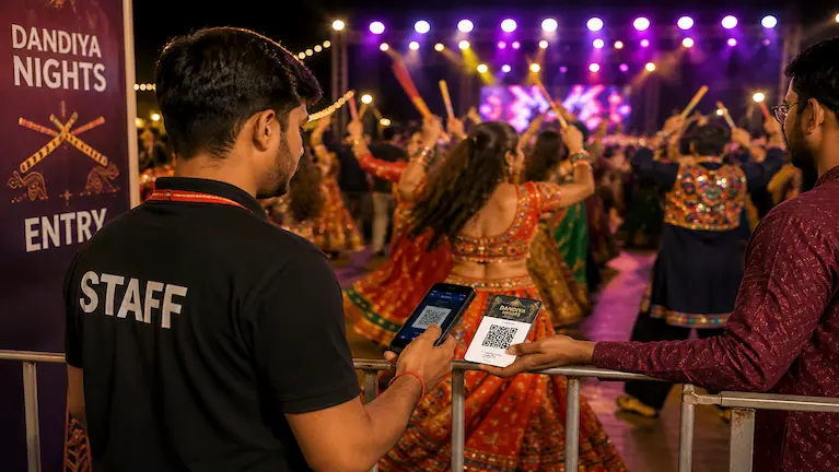 Event staff scanning a QR ticket at a Dandiya Night entry gate